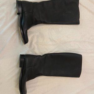 Knee- High Prada Combat Boots.